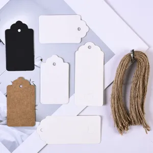 Blank kraft paper hang tags and natural jute twine set, assorted shapes for gifts.