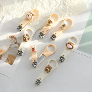 Cortauñas Plegable Lindo de Dibujos Animados Color Crema Herramienta de Manicura Antisalpicaduras Portátil Con Figura de Resina 3D Plástico Acero Inoxidable