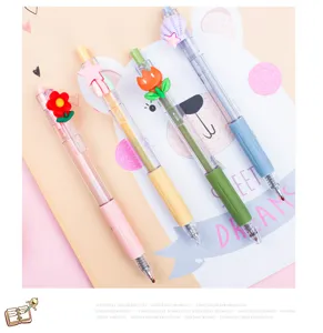 Joli ensemble de stylos gel pastel avec décorations de fleurs et d'étoiles de dessin animé.