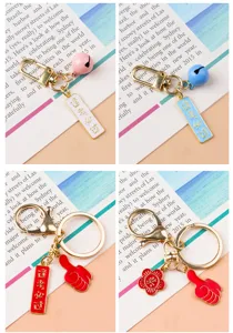 Porte-clés en métal avec breloque de bénédiction, jolie cloche et pendentif pouce levé.
