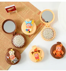 Jolie brosse à cheveux pliante de dessin animé avec miroir peigne de poche portable pour filles.