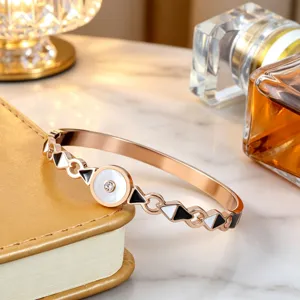 Exquisite rose steel mother of pearl bracelet detailed view showcasing geometric enamel design.