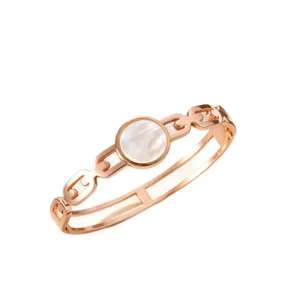 Rose gold plated titanium steel bracelet with white mother of pearl round centerpiece for women