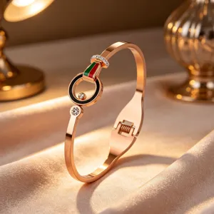 Rose gold titanium steel bracelet with red green details and crystal accents for women.