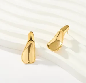 Gold irregular metal stud earrings with smooth finish, modern minimalist design.