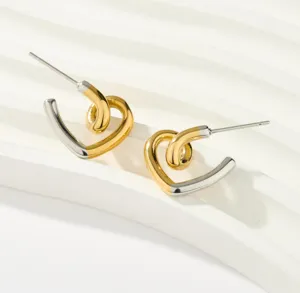 Pendientes de aro en forma de corazón bicolor oro y plata minimalistas detalle joya