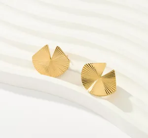 Detailed view of gold geometric fan shaped stud earrings with elegant radial textured design.