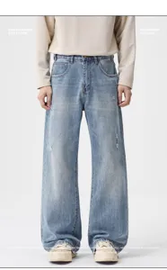 Men's retro distressed loose fit wide leg denim jeans with vintage casual washed style.