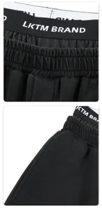 Men's black sweatpants featuring trendy double waistband and loose straight fit for daily casual wear.