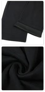 Detailed view of the black athletic sweatpants, showing the hem and soft fabric texture.