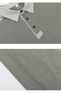 Detailweergave van een heren poloshirt met lange mouwen, contrastkleur en drukknoppen.