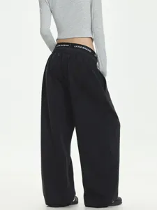 Trendy black loose straight sweatpants with a double waistband design for casual wear.