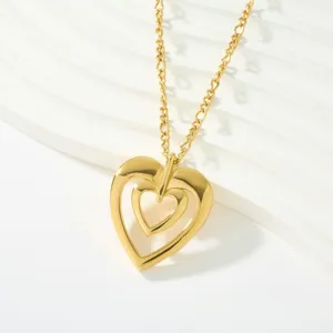 Close-up of a stylish 18k gold plated stainless steel hollow double heart pendant necklace.