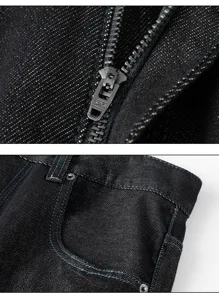 Detailed close-up of dark denim jeans featuring metal zipper and contrast stitching details.