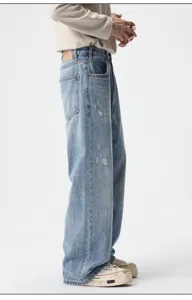 Vintage distressed loose fit denim jeans for men, American vibe retro style trousers.