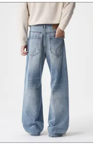 Men's distressed baggy denim jeans, vintage wash loose fit casual wide leg trousers.