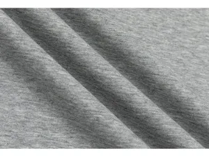 Detailed view of soft heather gray knitted fabric texture for long sleeve t-shirt apparel.