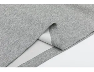 Grey heavyweight long sleeve t-shirt fabric detail, premium cotton blend texture.