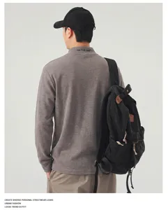 Detailed view of the men's casual mock neck long sleeve t-shirt in grey, loose fit style.