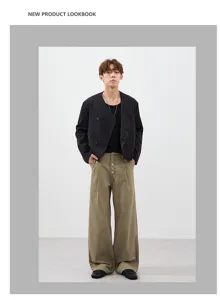 Detailed look at retro men's casual outfit with black jacket and pleated cargo trousers.