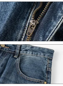 Close up view of retro blue denim jeans featuring copper zipper and detailed pocket stitching.