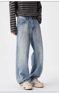 Men's retro streetwear straight leg jeans featuring stylish paint splatter design in light blue denim.