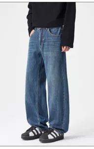 Detailed view of vintage blue washed loose straight-leg denim jeans for casual daily wear.