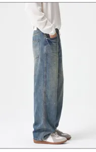 Men vintage loose straight leg denim jeans featuring stylish blue wash and paint splatter details.