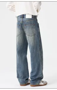 Men's loose fit washed denim jeans retro straight leg back view detail showing vintage styling.