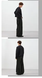 Detailed view of men and women loose wide leg casual trousers, showing fit and drape style.