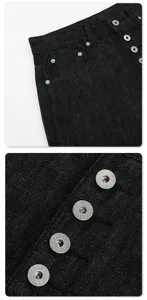 Detailed view of mens dark retro straight denim jeans featuring vintage metal button closure.