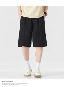 Detail shot of men's casual linen shorts, showing lightweight fabric and loose five-point fit.