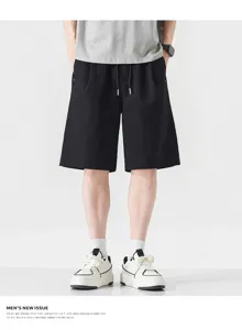 Men casual black drawstring shorts detail view, lightweight comfortable summer daily wear.