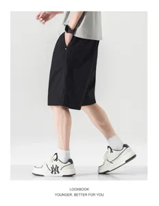 Men lightweight solid color casual shorts summer loose straight leg basic trousers detail view.