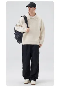 Detailed view of the casual polo collar knit sweater, styled with cargo pants for effortless look.