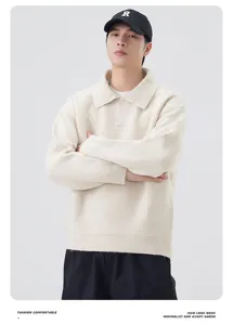 Detail view of a cozy loose knit polo sweater in off white, soft texture, classic lazy style.