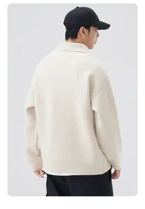 Detailed view of the back of a casual loose knit polo sweater in off-white style.