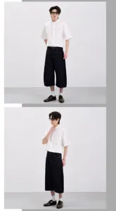Cleanfit style men's apparel detail, featuring white shirt and dark denim cropped pants.