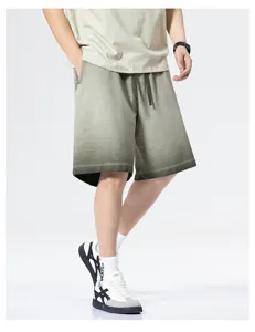 Detail view of men's summer vintage gradient tie-dye casual shorts, loose fit streetwear.