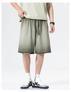 Men's casual gradient tie-dye shorts detail view, loose fit athletic five-quarter style.