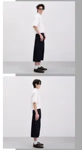 Detail view of the clean fit curved raw denim cropped wide leg pants paired with a shirt.