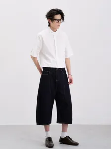 Men's clean fit short-sleeve shirt and dark cropped wide-leg denim jeans casual set.