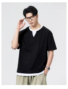 Detail view of men short sleeve fake two piece t shirt black white collar casual style texture.