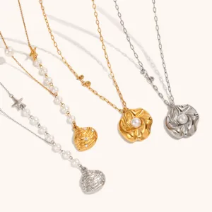 Detailed view of ocean style pearl and shell pendant necklaces, metal chains and floral charms.