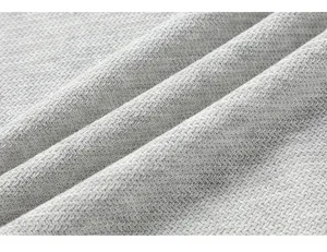 Vista ravvicinata del dettaglio della texture del tessuto in lino tencel grigio a spina.
