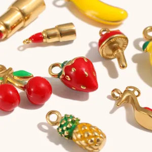 Detailed shot of assorted fruit and daily items enamel stainless steel gold plated charms.