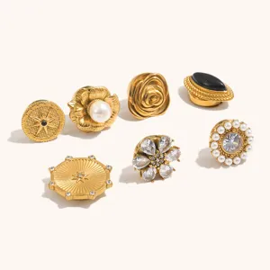 Detail shot of 18k gold plated stainless steel vintage suit buttons and jewelry accessories.