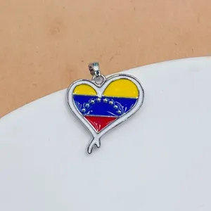 Detailed close-up shot of the heart-shaped national flag enamel pendant necklace accessory.