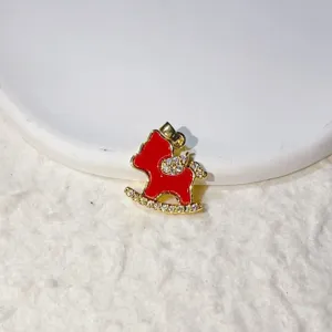 Charming gold brass rocking horse pendant with red enamel and sparkling zirconia stones.