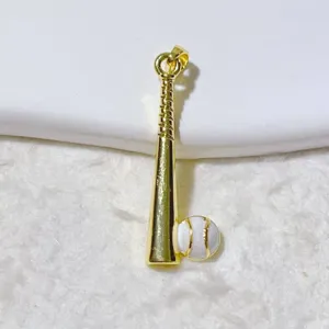 Detailed close-up of a gold-plated baseball bat and ball pendant, perfect for DIY jewelry.